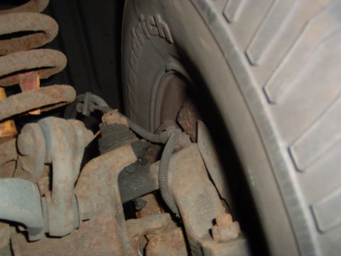 1993 Ford Bronco - Vehicle suspension parts and tire detail.