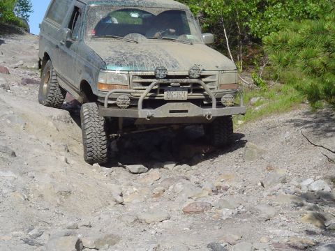 1993 Ford Bronco - This 1993 Ford Bronco navigates a challenging rocky off-road path.