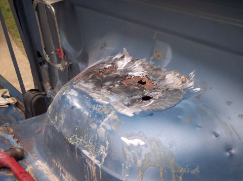 1990 Ford Bronco - This vehicle has significant rust damage in the wheel well area, requiring repair.