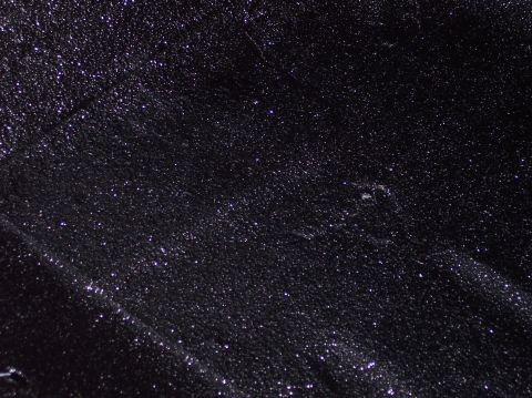 1990 Ford Bronco - Black textured surface with glittery particles, includes a watermark.