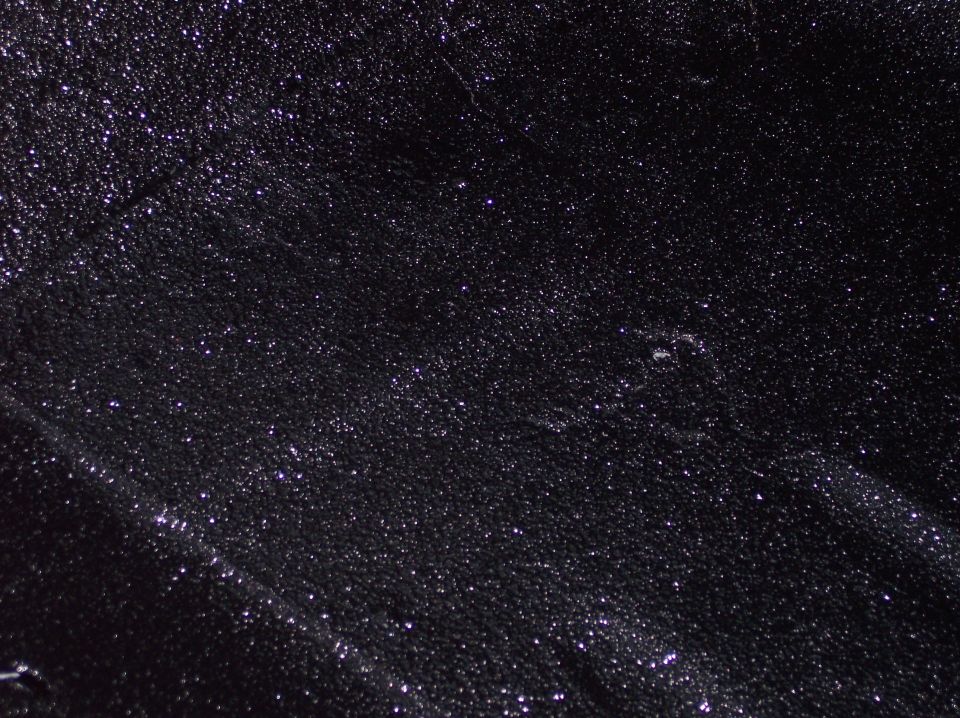 black textured surface with glittery particles, "SUPERMOTORS www.supermotors.net" watermark