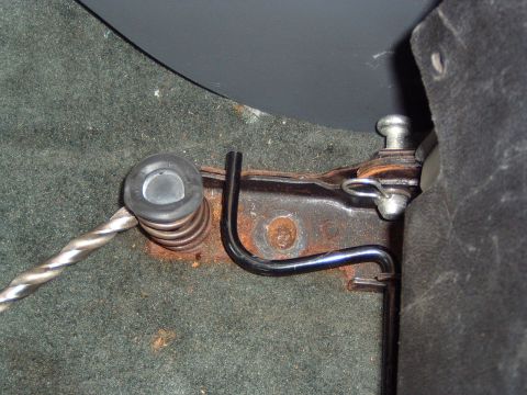 1993 Ford Bronco - Detail of a car seat's internal mechanism, showing a spring and linkage components.