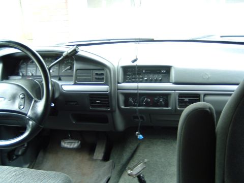 1993 Ford Bronco - Interior view of a 1993 Ford Bronco, showing the dashboard, steering wheel, and center console.
