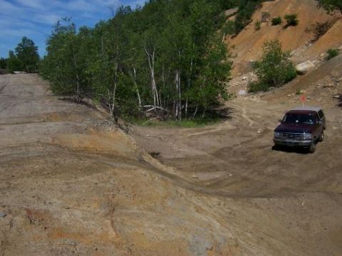 1996 Ford Bronco - 1996 Ford Bronco navigating an off-road trail.