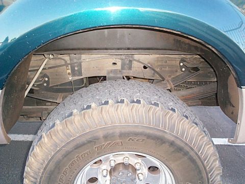 1999 Ford F-250 - Close-up of the rear suspension and wheel well on a 1999 Ford F-250.