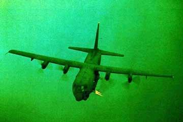 1988 Ford Bronco - Lockheed C-130 Hercules aircraft in flight. Supermotors.com logo is visible.