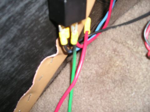 1996 Ford Bronco - A close-up view shows an automotive relay connected to various colored wires.
