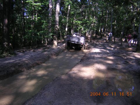 1984 Chevrolet Blazer - Off-roading in the woods, this 1984 Chevrolet Blazer tackles a deep mud pit.