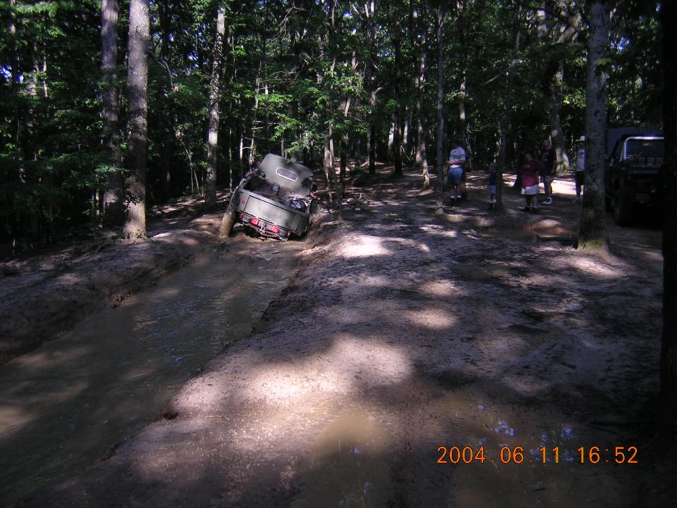 Off-road vehicle stuck in mud, 2004 timestamp