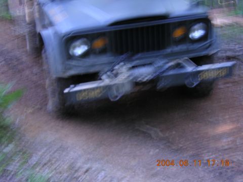 1984 Chevrolet Blazer - A vintage Jeep J-series truck is shown from the front, equipped with a winch and a custom bumper.