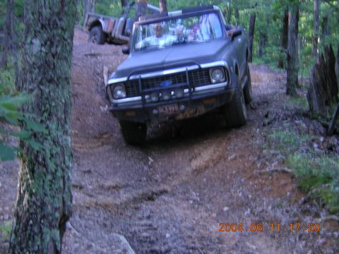 1984 Chevrolet Blazer - This vehicle is navigating a steep, wooded trail with another vehicle in the background.