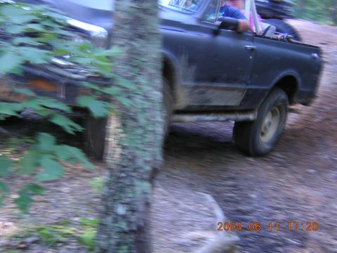 1984 Chevrolet Blazer - A black SUV navigates a wooded trail, with a timestamp indicating it was taken on June 11, 2004.