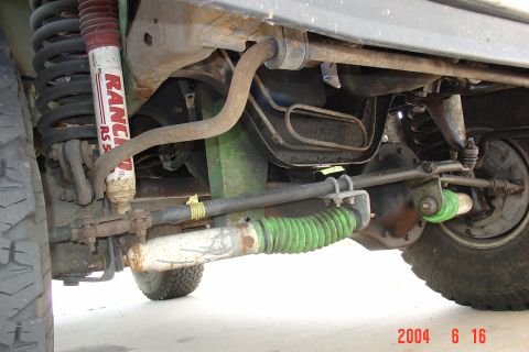 1987 Ford Bronco - Vehicle undercarriage detail, focusing on suspension and steering components.