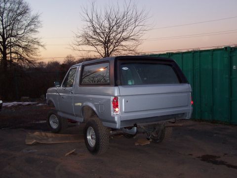 1990 Ford Bronco - This silver 1990 Ford Bronco is shown from the rear, possibly after a paint job.