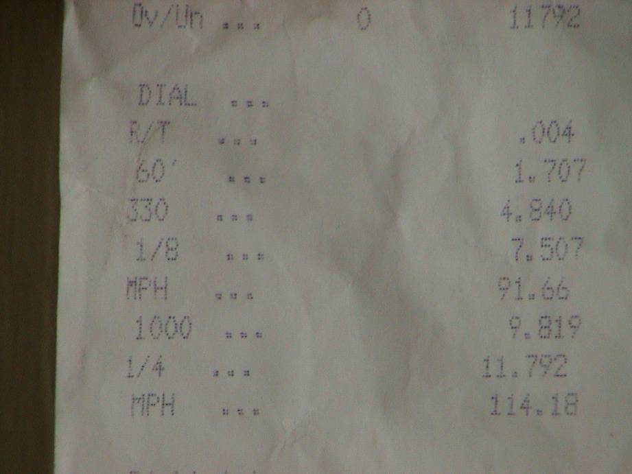 Drag strip timeslip showing 60-foot 1.707, 1/8 7.507, quarter mile 11.792 at 114.18 mph