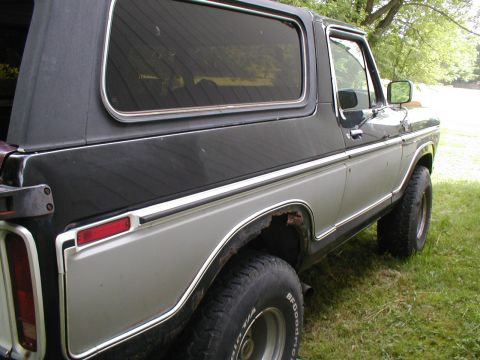 1979 Ford Bronco II - The two-tone paint and chrome trim on this 1979 Ford Bronco II are visible from the three-quarter front perspective.