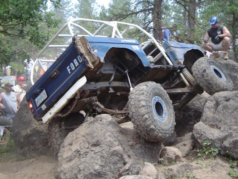 1989 Ford Bronco - Modified 1989 Ford Bronco tackling a difficult rock crawling course with a custom roll cage.