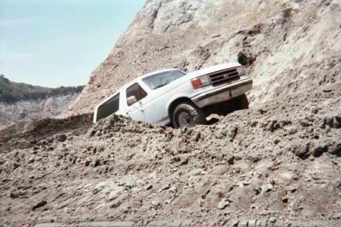 1990 Ford Bronco - Climbing a hill the construction crew made.