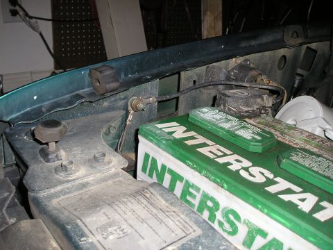 1996 Ford Bronco - The engine bay shows an Interstate battery and various mechanical components under the hood.