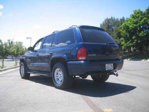 2001 Dodge Durango - Rear view of a blue 2001 Dodge Durango SUV parked in an outdoor lot on a sunny day.