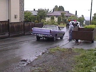 1968 Ford Ranchero - A purple 1968 Ford Ranchero is seen from the rear as it is being towed to a shop.