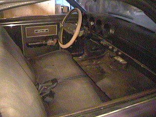 1968 Ford Ranchero - Interior view of a 1968 Ford Ranchero, showing the dashboard, seats, and door panel.