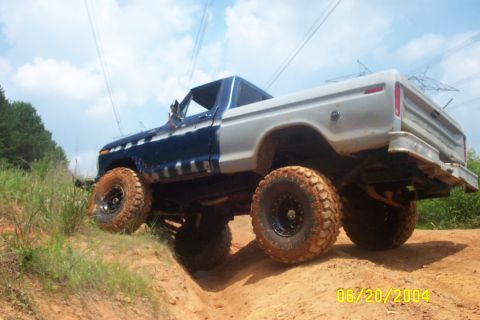 1979 Ford F-150 - Modified 1979 Ford F-150 navigates an off-road course on a sunny day.