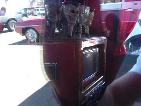 1989 Ford Bronco - Interior view of a vehicle skull-themed glasses and a television screen.