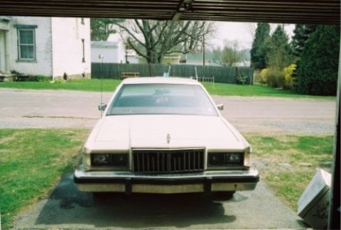 1987 Mercury Grand Marquis - This 1987 Mercury Grand Marquis is seen from the front, parked in a driveway under a carport.