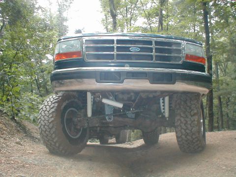 1995 Ford Bronco - This 1995 Ford Bronco features a lifted suspension and off-road tires, viewed from the front.