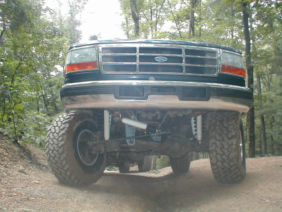 Green 1995 Ford Bronco front end with lifted suspension