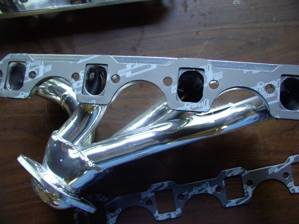 Mr Gasket Ultra-Seal gaskets #5930. Coating them in Permatex high heat Ultra Copper as it works on my collector gaskets and my pipe bender buddy's race car.  Hey Fireguy note how they're already trimmed for spark plug access. CTC #34-7905-6