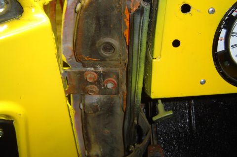 1974 Ford Bronco - Close-up of a vehicle's door jamb and part of the dashboard.