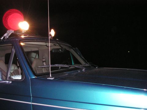1996 Ford Bronco - This 1996 Ford Bronco features roof-mounted lights and an antenna, seen from a three-quarter front view.
