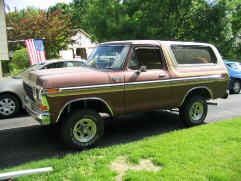 1979 Ford Bronco - This 1979 Ford Bronco features a two-tone brown paint scheme with woodgrain trim accents.