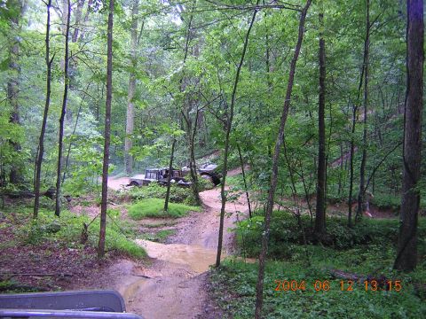 1984 Chevrolet Blazer - Off-road vehicles navigate a muddy forest trail, with a date stamp of 2004.