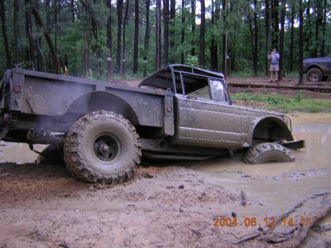 1984 Chevrolet Blazer - Off-road vehicle stuck in mud pit with another vehicle in the background.