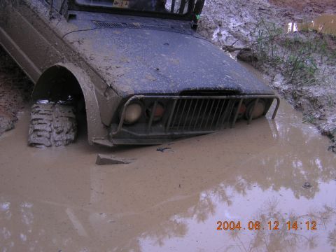 1984 Chevrolet Blazer - Vehicle stuck in mud, showing front grille and headlights. Date stamp: 2004.06.12