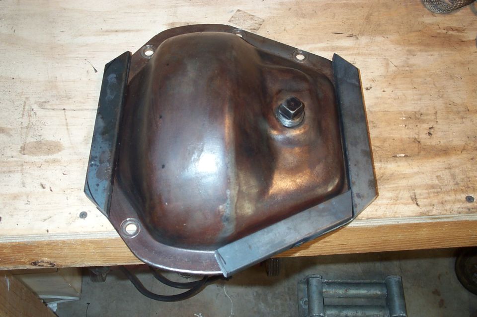 Every beafy 1 ton axle needs some protection from the rocks up front.  This is the start of a 1/2 thick ring which was cut and welded around the stock cover.