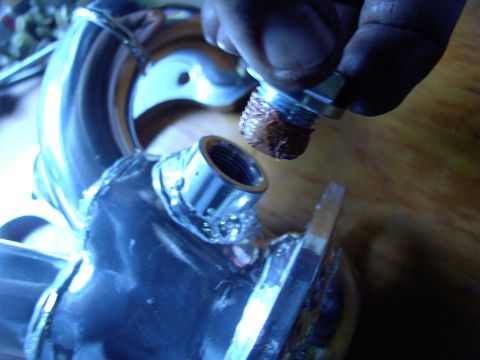 1986 Ford Bronco - Plugging the driver's side 02 provision, with sensor safe Permatex Ultra Copper high heat sealant.