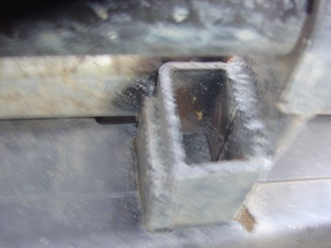 1993 Ford Bronco - This photo shows a custom-made metal bracket, possibly for attaching aftermarket accessories to a vehicle.