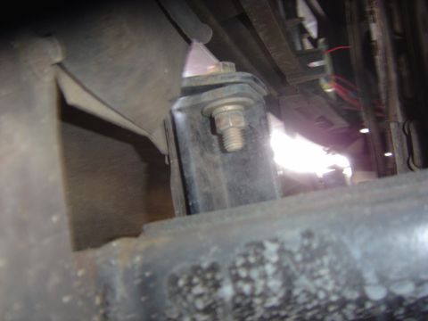 1993 Ford Bronco - Undercarriage view of a vehicle's frame and suspension components, showing bolted brackets and wiring.