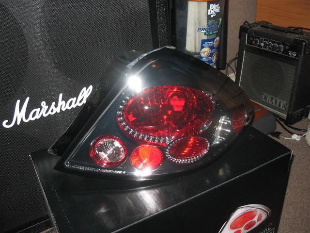 Chrome-trimmed red taillight with multiple bulbs