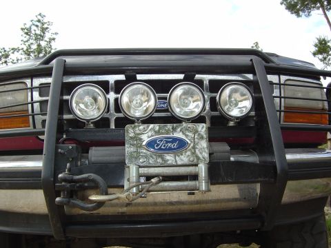 1993 Ford Bronco - Front view of a 1992 Ford Bronco equipped with a brush guard, spotlights, and a winch.