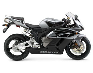 1994 Ford Bronco - Side view of a silver and black Honda sportbike motorcycle. Text on the fairing reads HONDA.