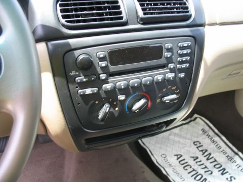 2000 Honda Accord - Close-up of a car's center console, showing the audio system and climate controls.