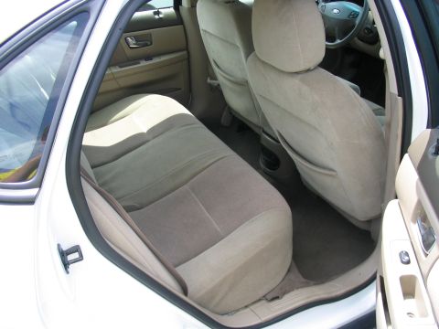 2000 Honda Accord - The interior of a car is shown, focusing on the back seat area and dashboard.