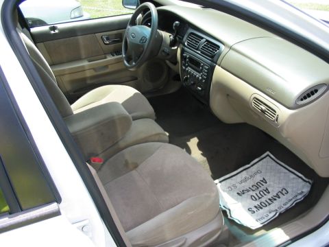 2000 Honda Accord - The interior of a car is shown, cloth seats and a dashboard with the radio and air vents.