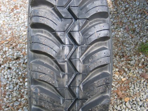 1995 Ford Bronco - The tread pattern on this tire features large, angular blocks for off-road traction.