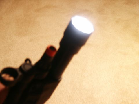 1991 Ford Bronco - A flashlight illuminates a surface with its bright LED light.